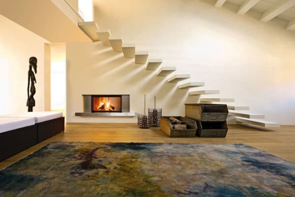 cheminée foyer bois MCZ Plasma 115 avec porte relevable design moderne